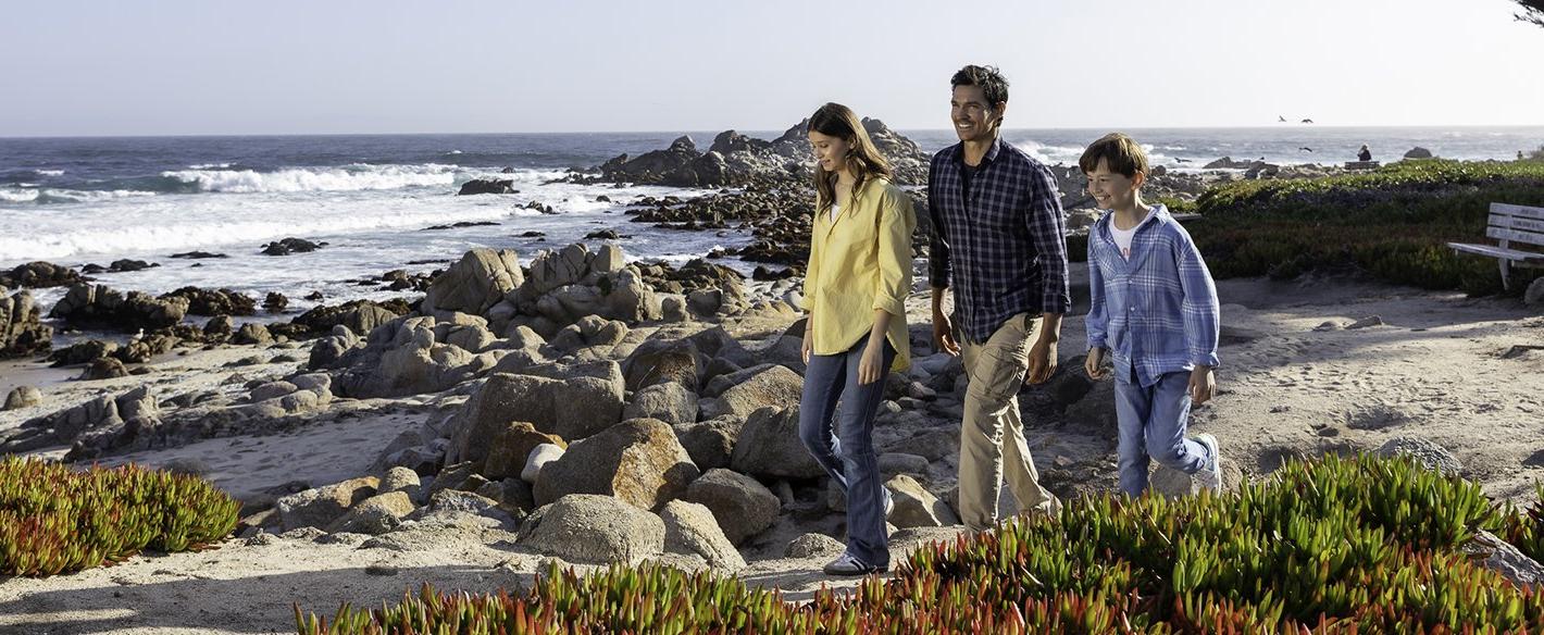 Father and his children walking on beach